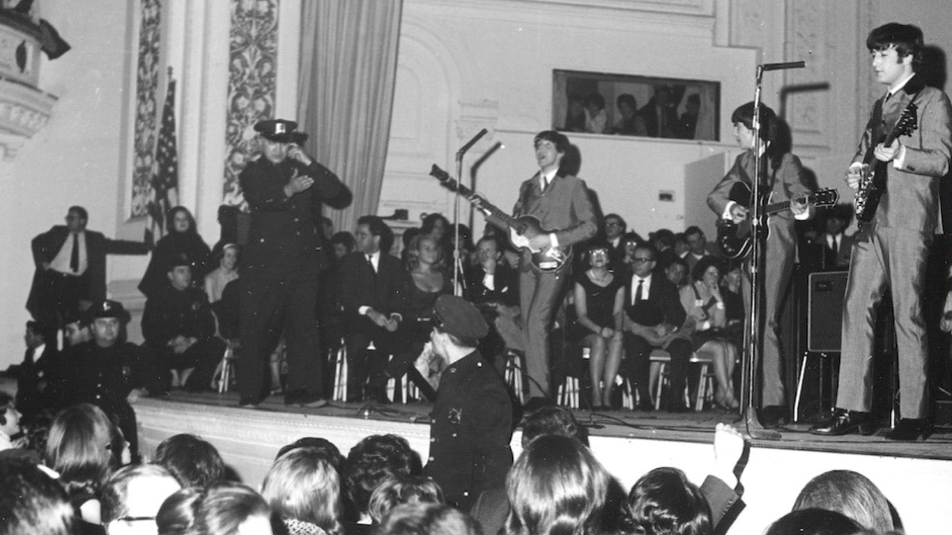 The Beatles band performing live on stage at The Carnegie Hall