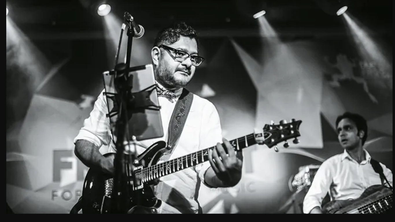 guitar being played black and white