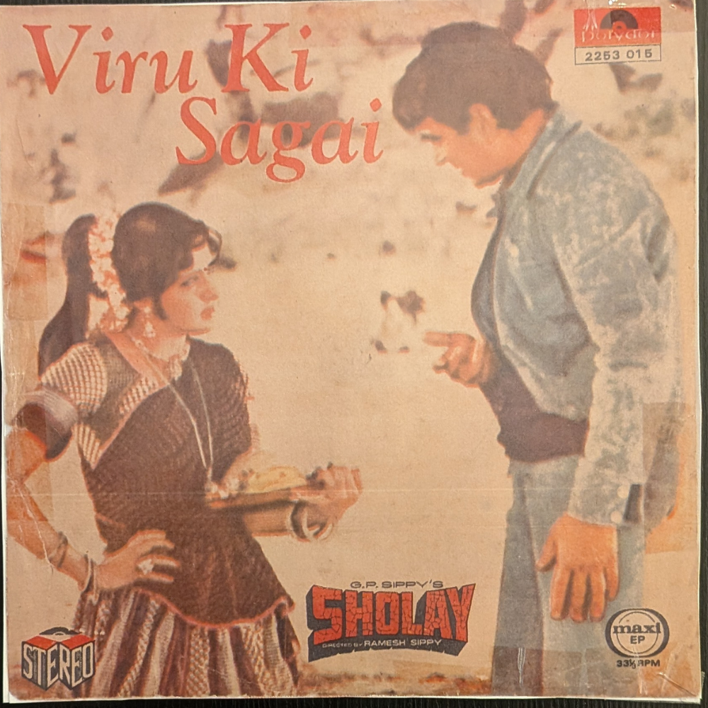 dharmendra,-hema-malini,-amitabh-bachchan-sholay---viru-ki-sagai-(viru's-engagement)-(7-inch-disc)-(reprinted-cover)-vinyl-record.jpg