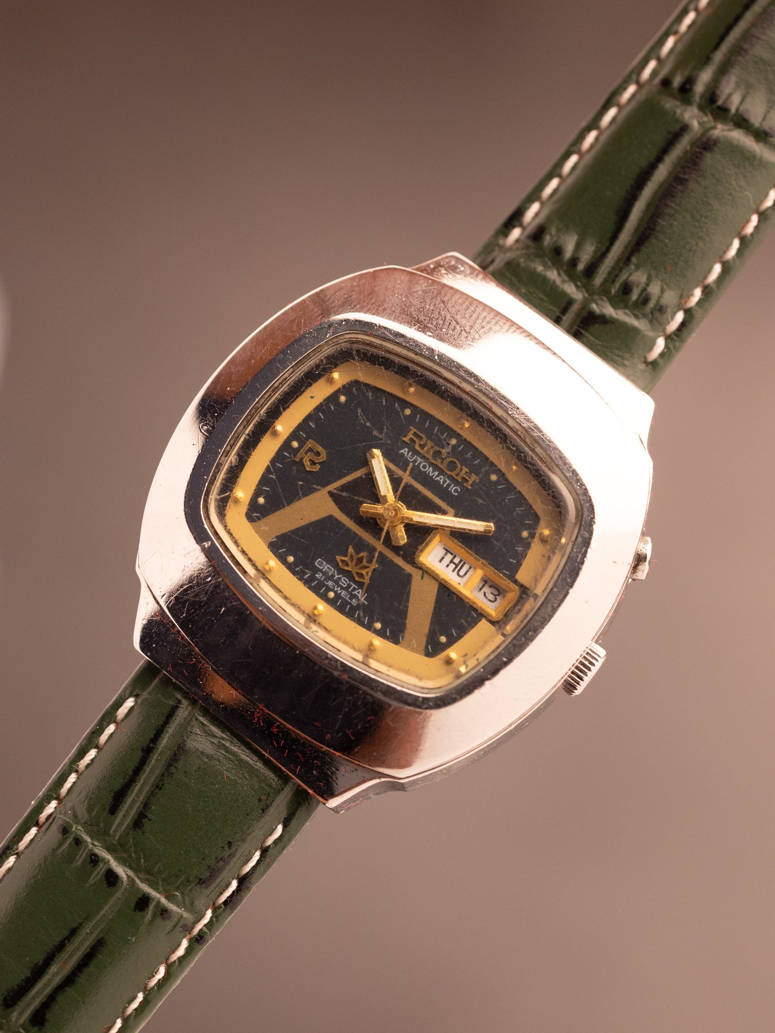 Ricoh Crystal Cusion Green Gold Symmetrical Dial (Ref. 061552