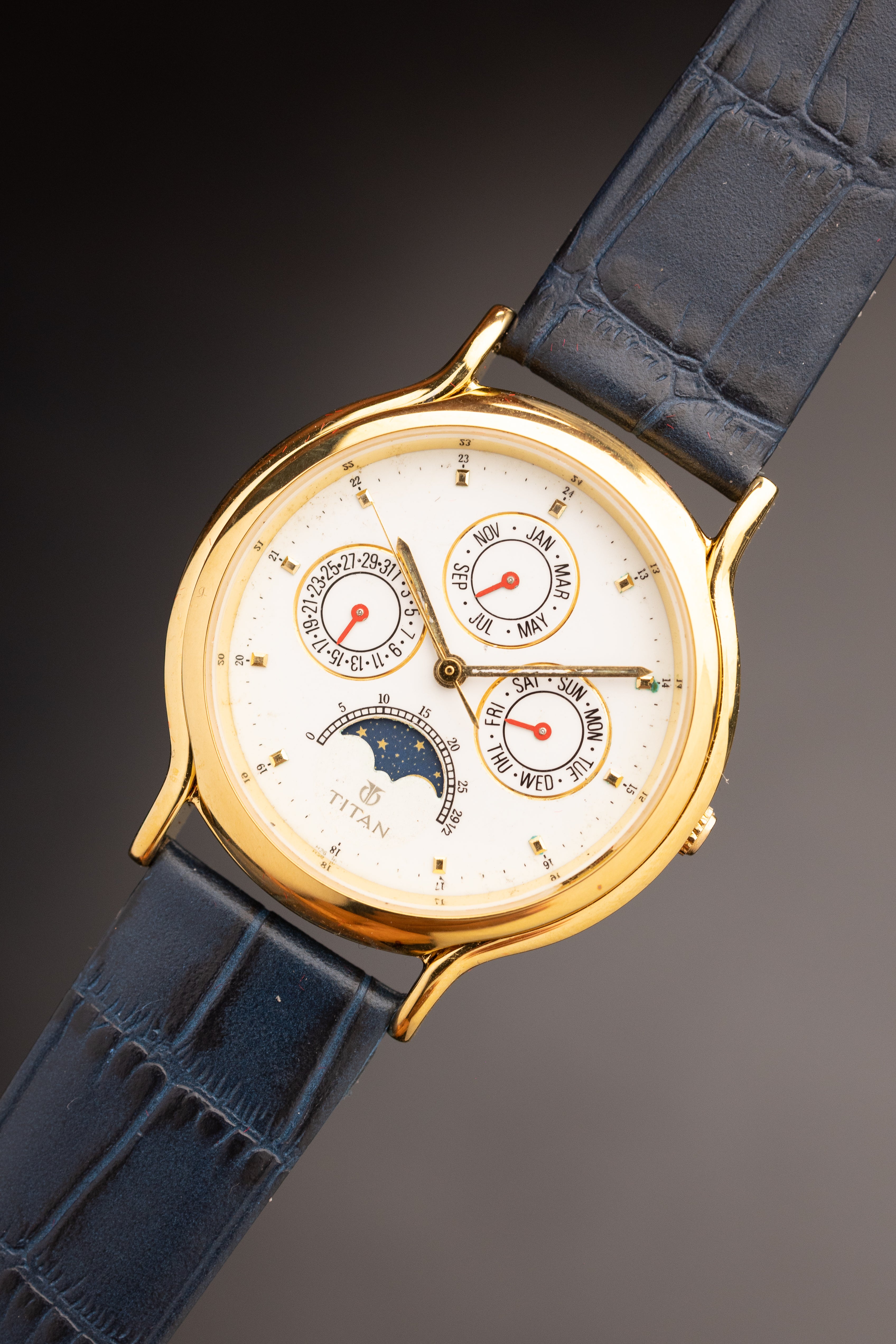 Titan Triple Calendar Moonphase (Ref. 257YAA) (36mm; Quartz)