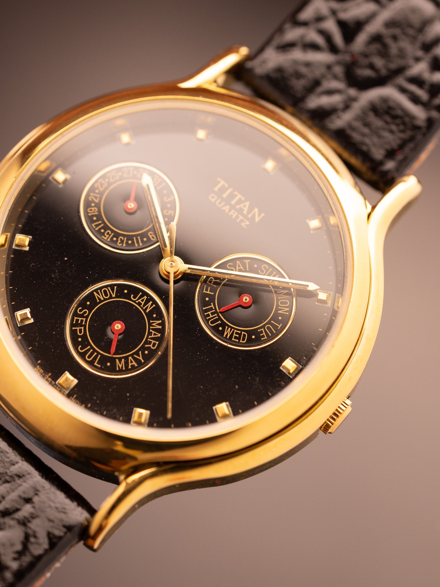 Titan Triple Calendar(Ref. 257YAA) (36mm; Quartz)