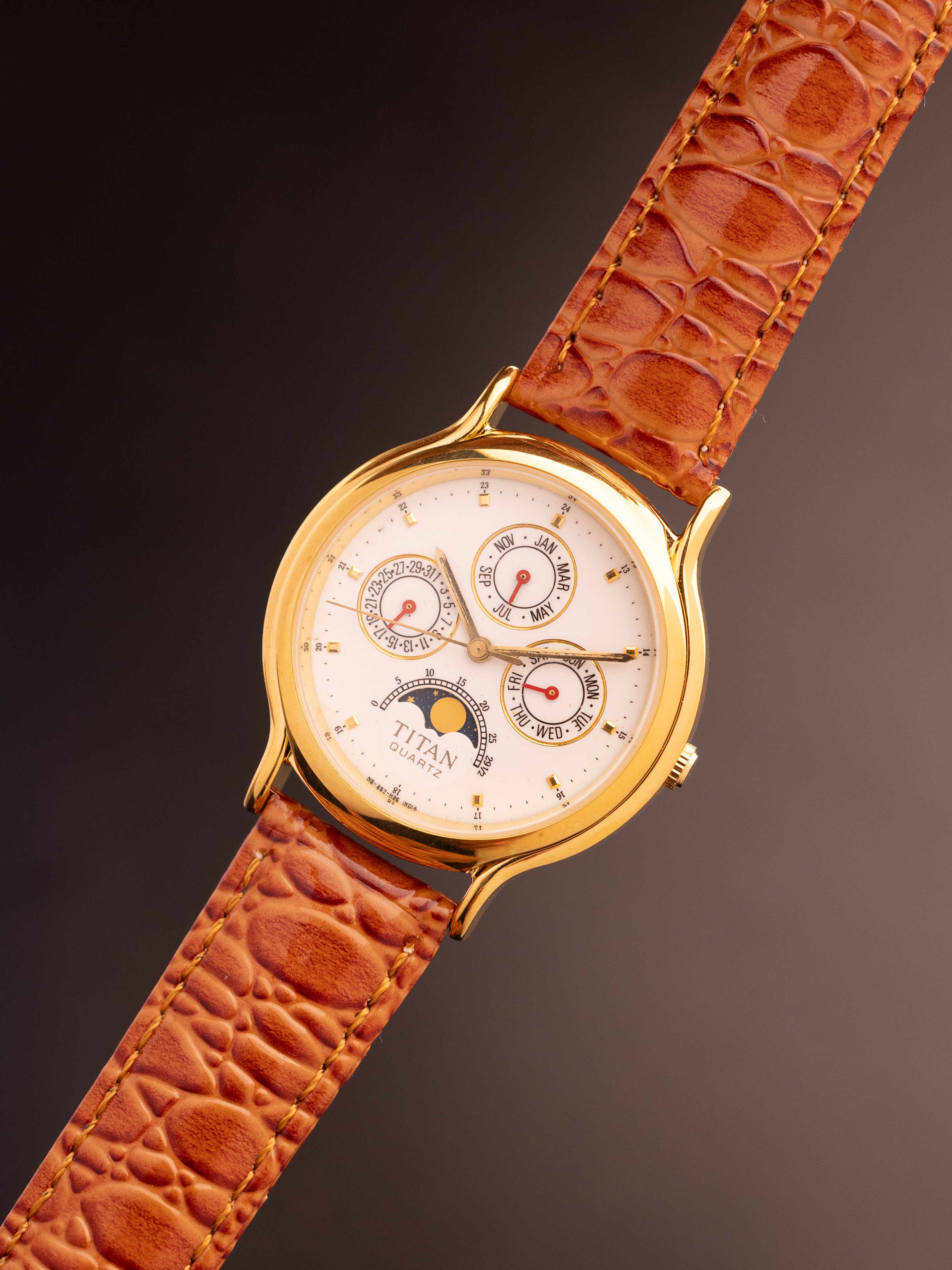 Titan Triple Calendar Moonphase (Ref. 257YAA) (36mm; Quartz)