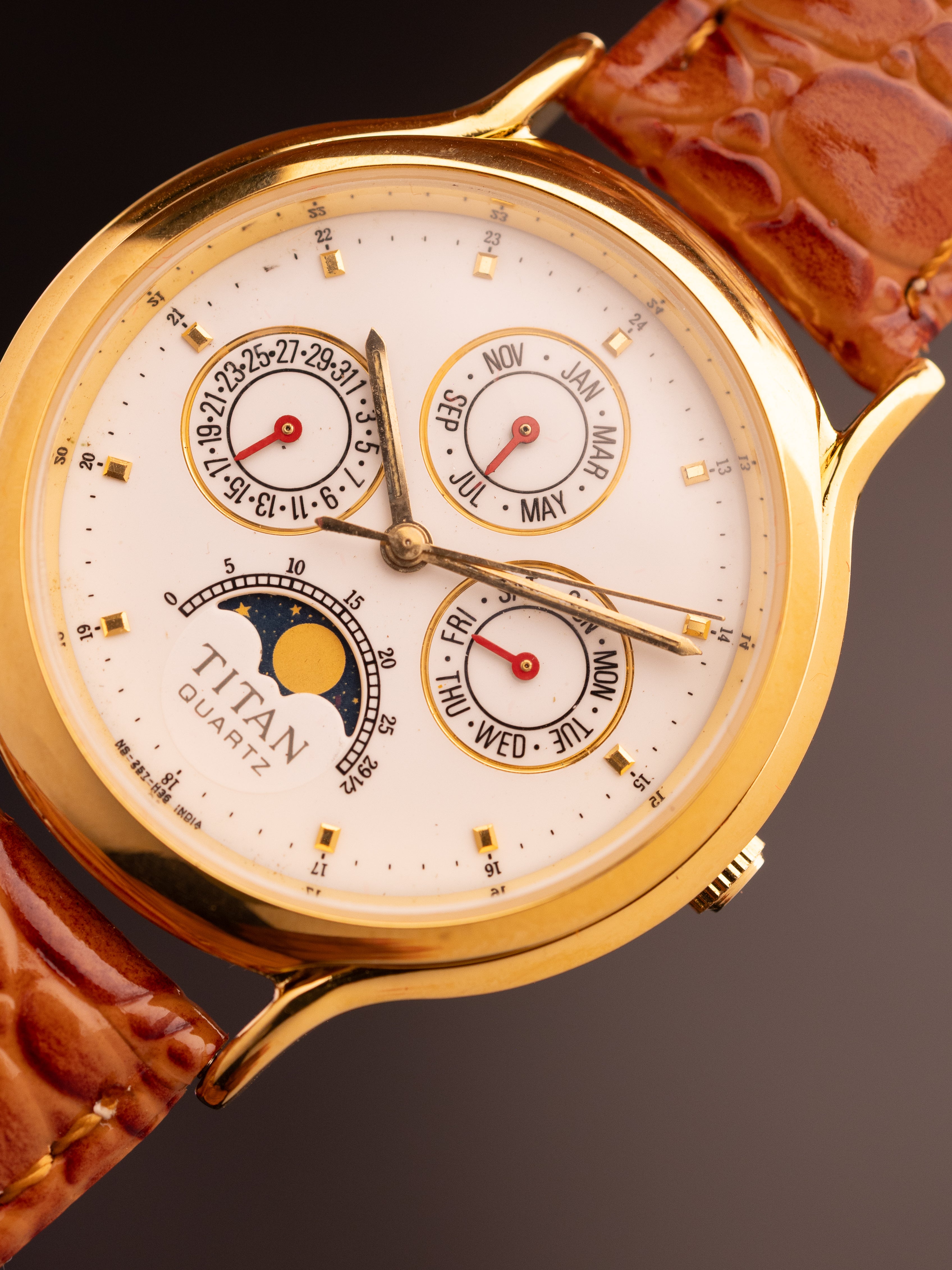 Titan Triple Calendar Moonphase (Ref. 257YAA) (36mm; Quartz)