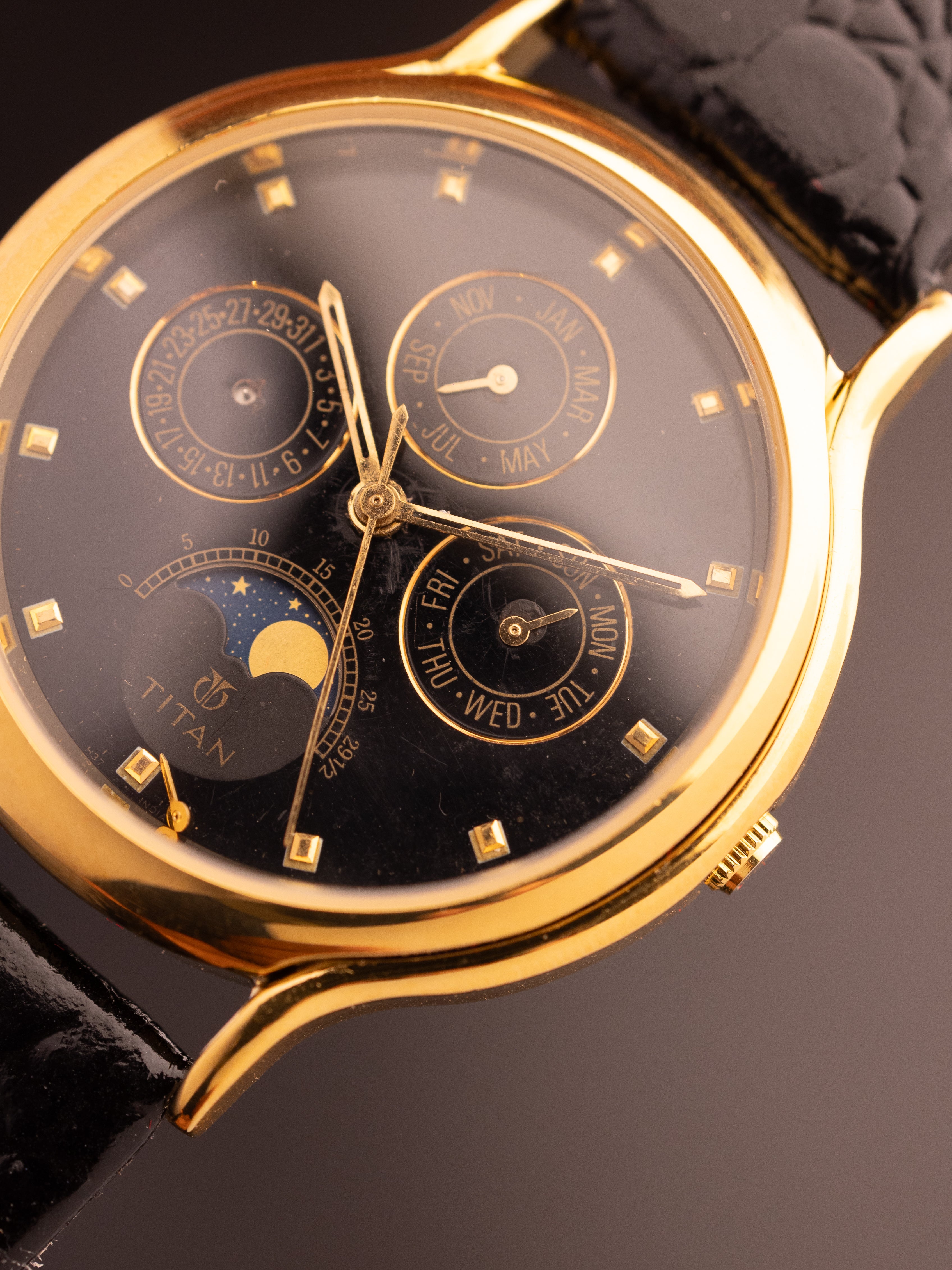 Titan Triple Calendar Moonphase (Ref. 257YAA) (36mm; Quartz)