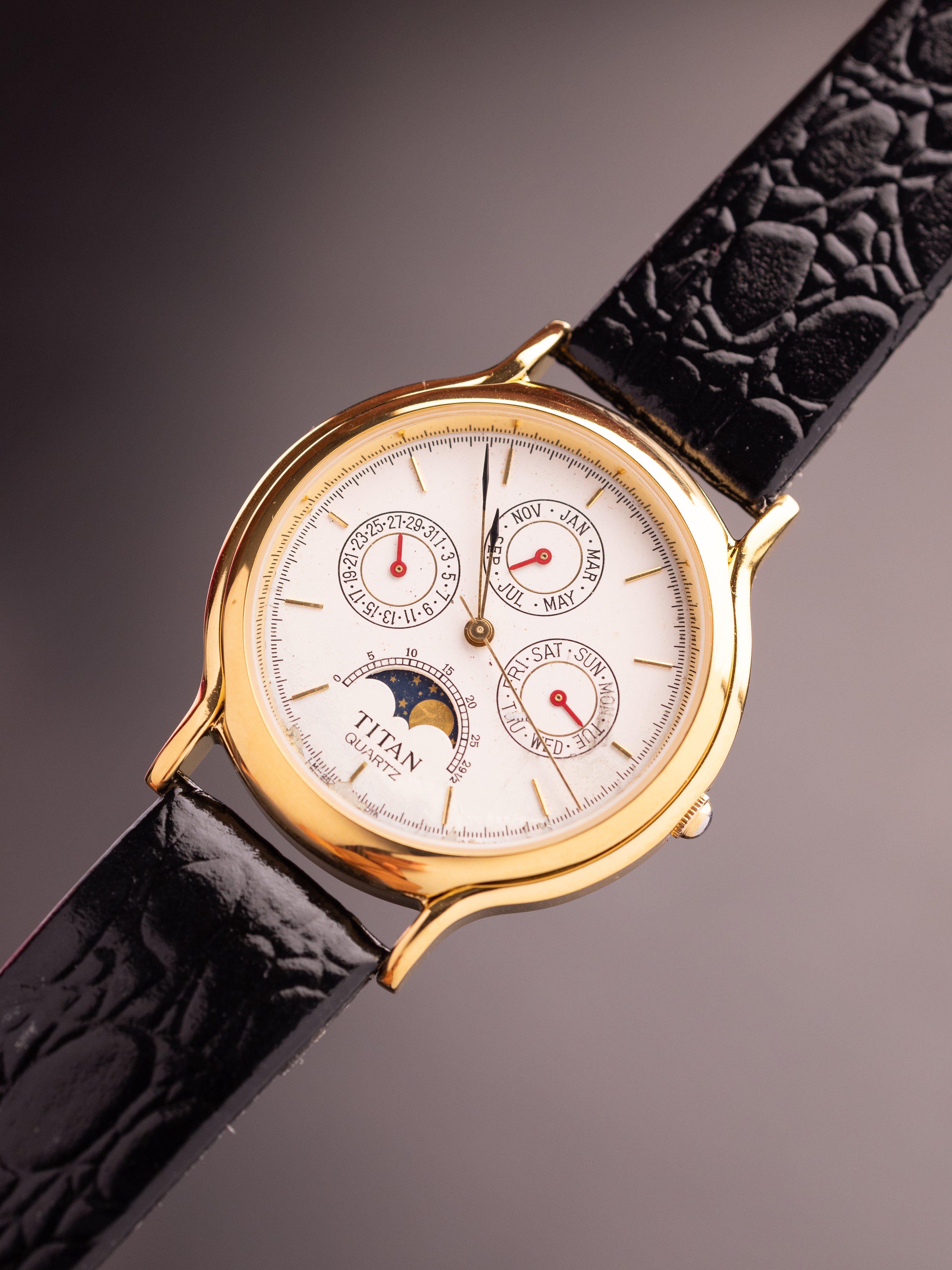 Titan Triple Calendar Moonphase (Ref. 257YAA) (36mm; Quartz)