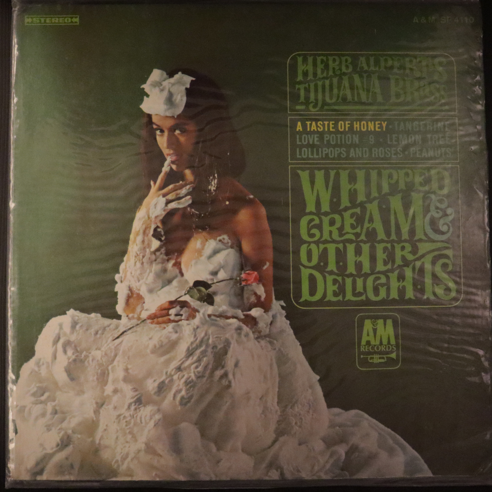 herb-alpert's-tijuana-brass*-whipped-cream-&-other-delights-vinyl-record.jpg